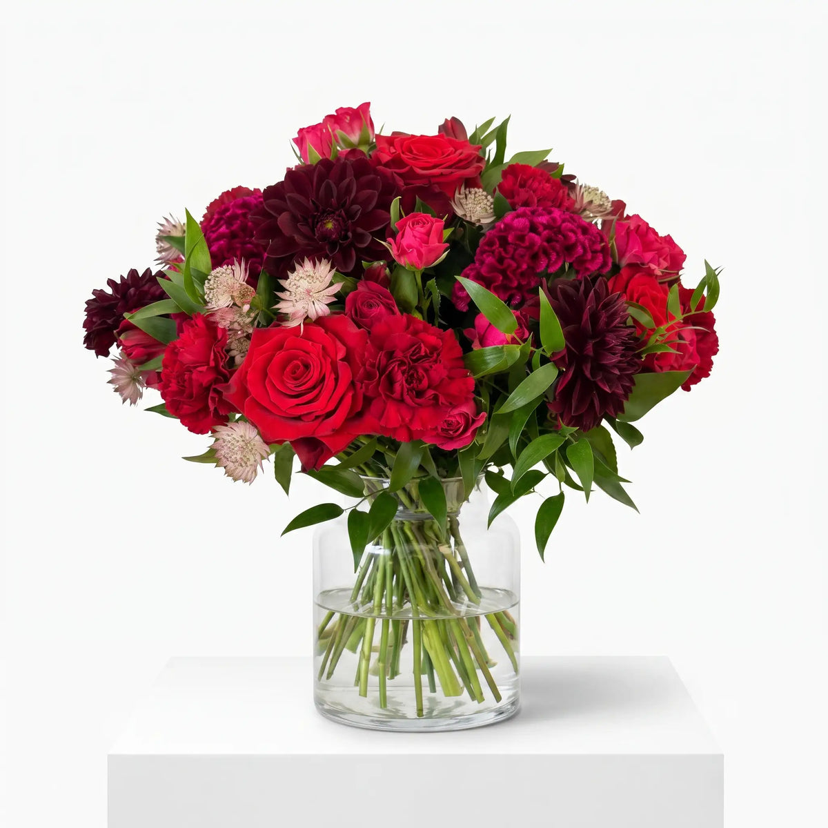 Crimson Kiss flower bouquet arranged in a glass vase