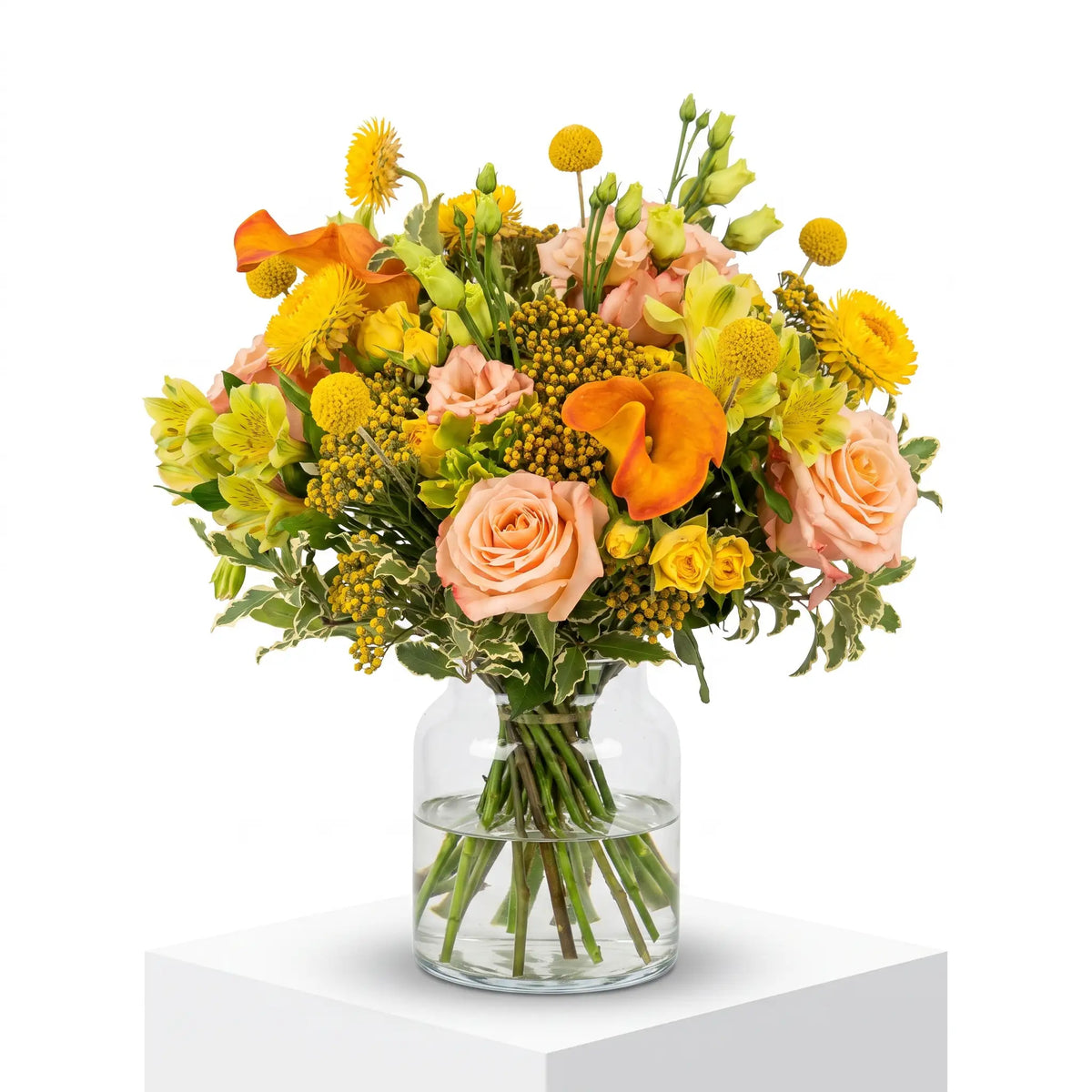 Golden Serenade flower bouquet arranged in a glass vase