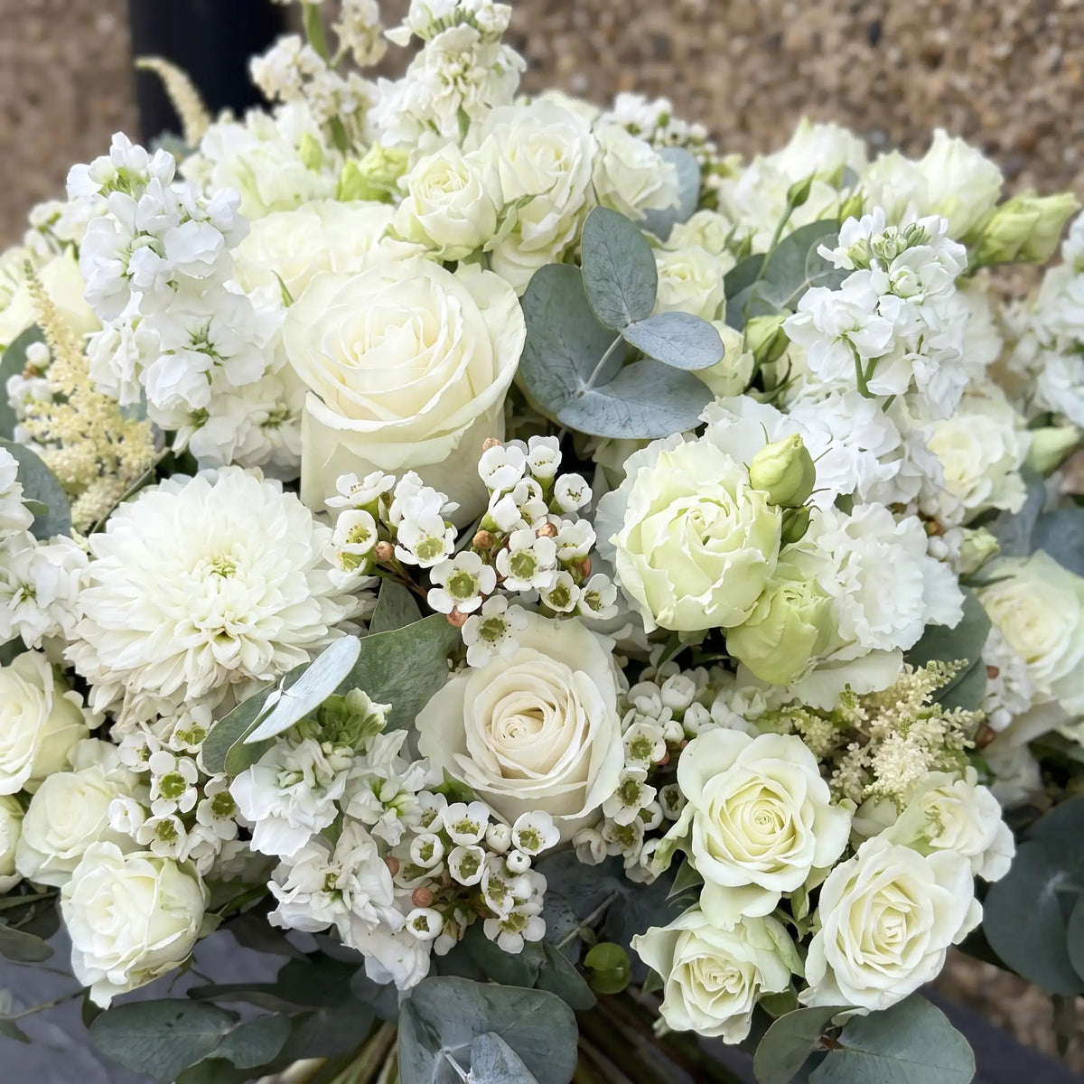 Close-up of Ivory Mist hand-tied flower bouquet