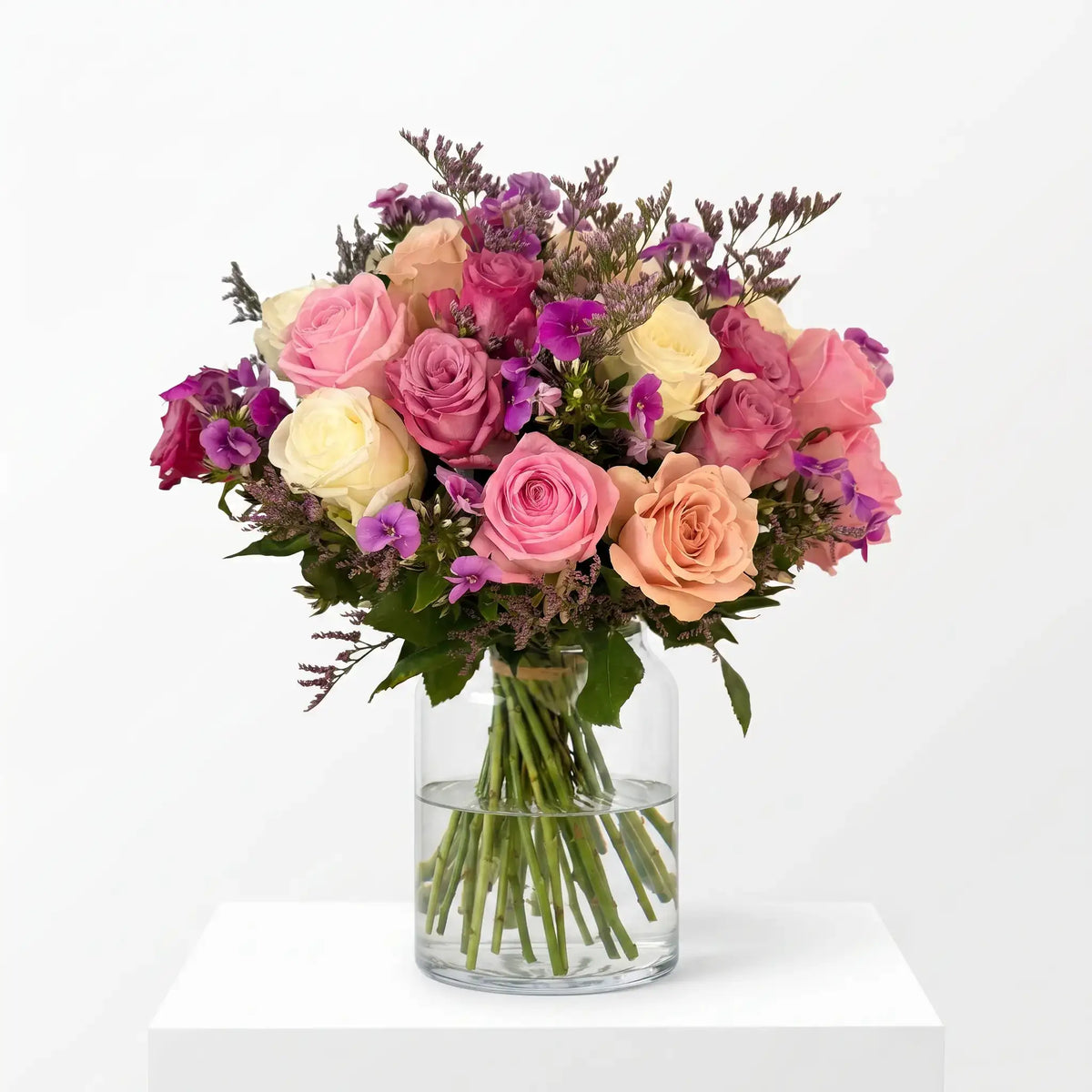 Pastel Melody flower bouquet arranged in a glass vase