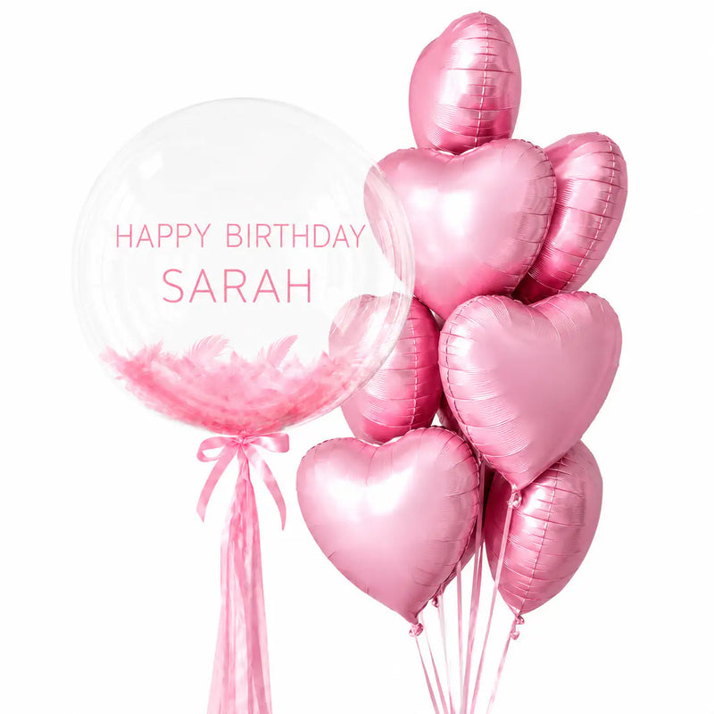 Baby pink personalised bubble and heart balloon bouquet with feathers by The SoArt
