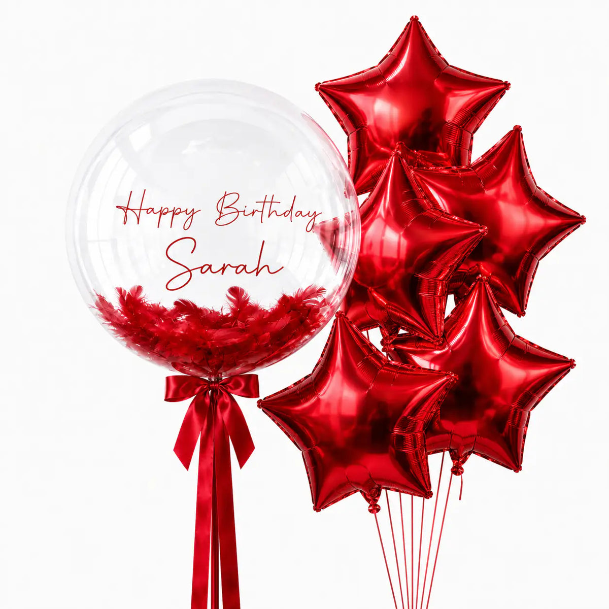 Red personalised bubble and star balloon bouquet with feathers by The SoArt