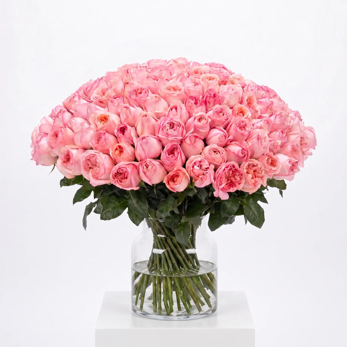Pink Royal flower bouquet arranged in a glass vase