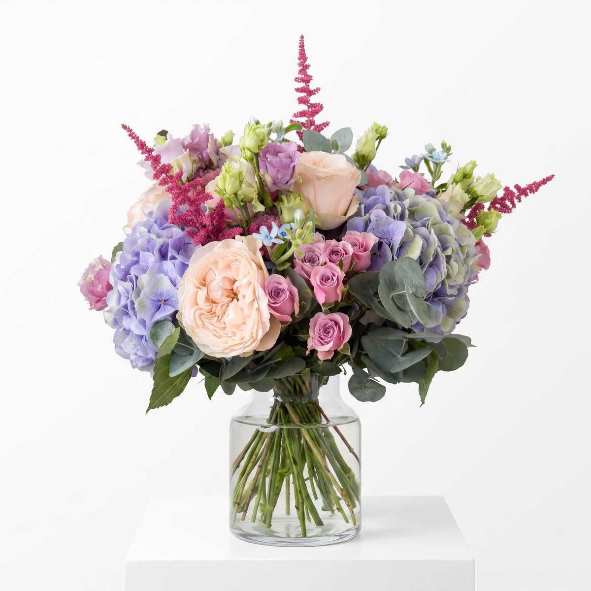 Violet Opal flower bouquet arranged in a glass vase